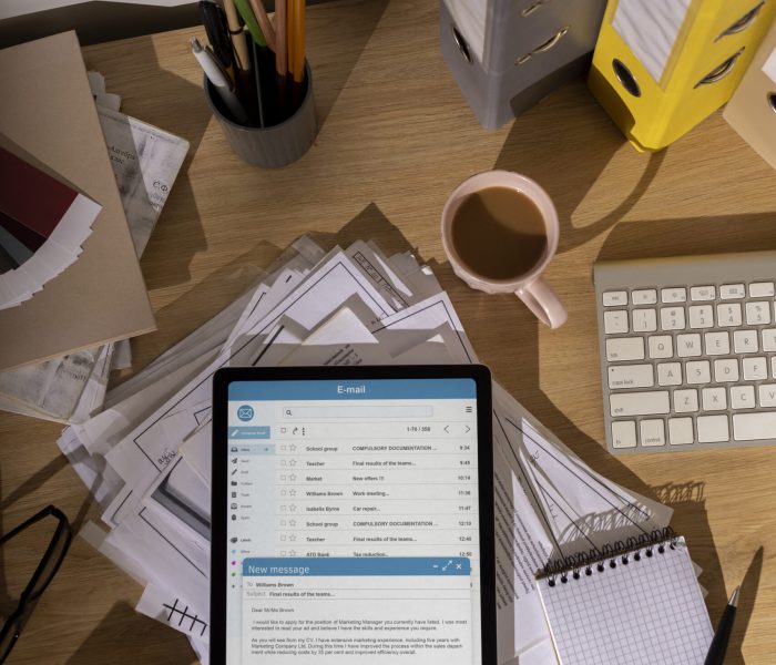 top-view-messy-office-workspace-with-tablet